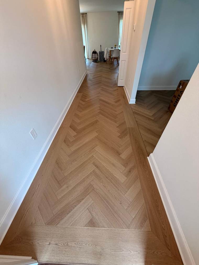 Herringbone hallway floor with a plank border