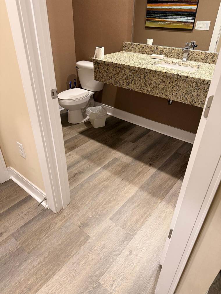 Vinyl plank floor in a powder room